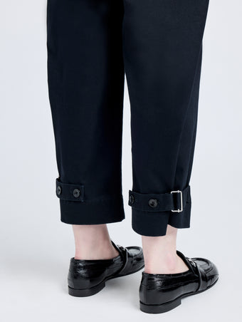 Detail image of model wearing Cotton Twill Tapered Pants in BLACK