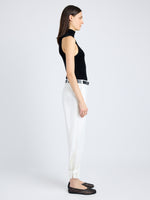 Side full length image of model wearing Cotton Twill Tapered Pants in OFF WHITE