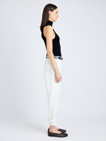 Side full length image of model wearing Cotton Twill Tapered Pants in OFF WHITE