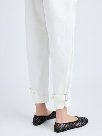 Detail image of model wearing Cotton Twill Tapered Pants in OFF WHITE