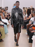 Runway image of model wearing Adele Skirt In Leather in black