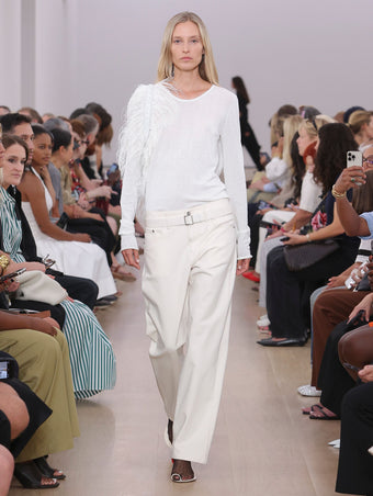 Runway image of model wearing Ellsworth Jean in ecru