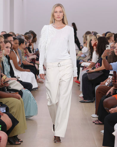 Runway image of model wearing Ellsworth Jean in ecru